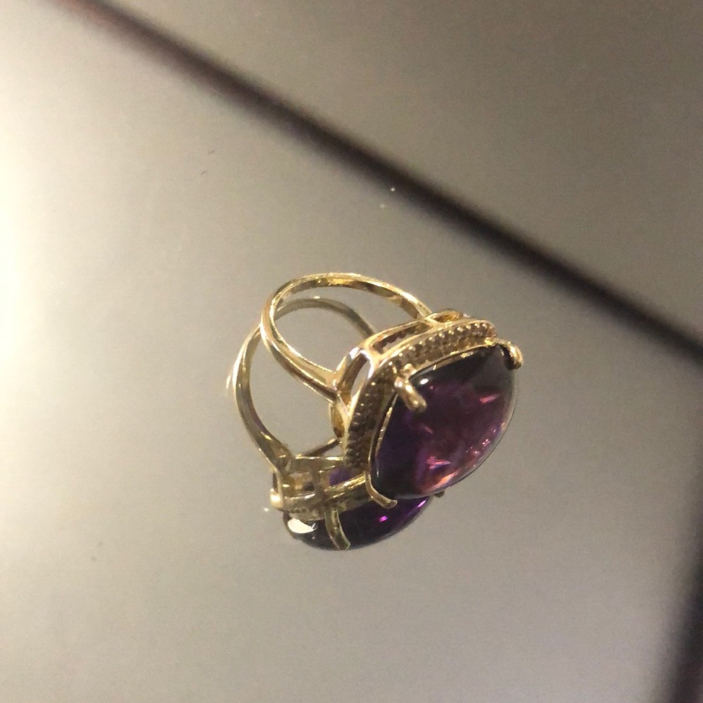 Gold ring with purple stone